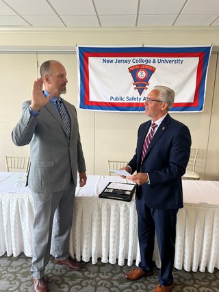 Past President Robert DiGenova swears in incoming President, Andrew Eaton
