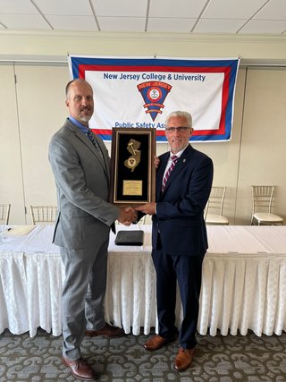 2025 President Andrew Eaton presents outgoing President Robert DiGenova with his Award.